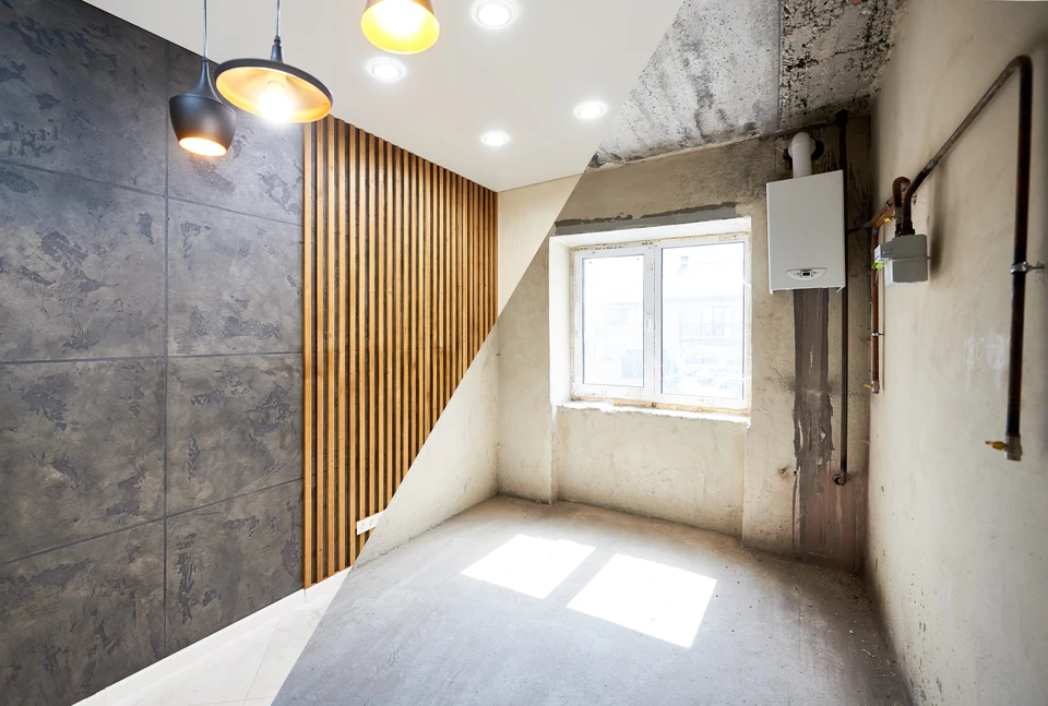 Chantier de rénovation intérieure avec ouvrier en bleu travaillant dans une pièce en cours d'aménagement